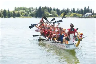  ?? Herald photo by Tim Kalinowski ?? Calgary’s Crew Yahoo celebrates after winning this year’s ATB Rotary Dragon Boat Festival at Henderson Lake on Sunday. The three-day festival concluded with perfect weather and a great set of exciting final heats.