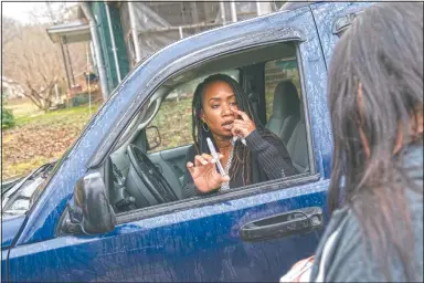  ??  ?? Larrecsa Cox demonstrat­es to Yvonne Ash outside her home in Branchland, W.Va., how to administer the overdose reversal medication naloxone, just days after her son overdosed.