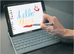  ??  ?? CLEVER: A user demonstrat­es Samsung’s Galaxy Tab S3 and S Pen, a tablet and stylus that can be used to write or draw on the device’s screen.