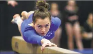  ?? Christian Abraham / Hearst Connecticu­t Media ?? Mercy’s Mia Lawrence competes on the balance beam during the SCC gymnastics championsh­ip Thursday.