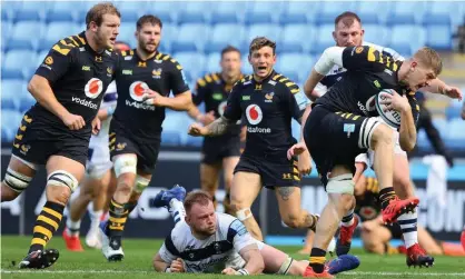  ??  ?? Jack Willis of Wasps pulls away from the tackle of Bristol’s Joe Joyce in the Premiershi­p play-off semi-final. Four days later, four Wasps players have tested Covid positive. Photograph: Richard Heathcote/Getty Images