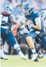  ?? STEW MILNE/AP ?? UConn quarterbac­k Steven Krajewski fumbles the ball during the first half against Purdue on Saturday in East Hartford. The Huskies lost 49-0.