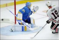  ?? BILL BOYCE — THE ASSOCIATED PRESS ?? Chicago Blackhawks’ Jonathan Toews, right, beats goalie Jake Allen in overtime to lift theChicago Blackhawks to a 5-4 victory over the St. Louis Blues Saturday night in St. Louis. It was Toews’ second goal of the night.