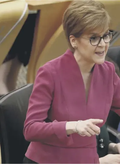  ??  ?? 0 Nicola Sturgeon, pictured during yesterday’s First Minister’s Questions at Holyrood, attacks the UK