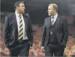  ??  ?? Mackay chats with SFA chief executive Stewart Regan at Pittodrie.