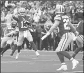  ?? Associated Press ?? 49ers quarterbac­k Brock Purdy (13) throws a touchdown pass to running back Christian McCaffrey (23) during the first half of an NFL wild-card playoff game, Saturday, in Santa Clara.