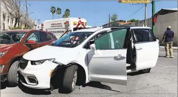  ?? Associated Press ?? A MEMBER OF the Mexican security forces stands near a white minivan with North Carolina license plates and several bullet holes, at the spot in Matamoros where gunmen kidnapped four U.S. citizens on Friday.