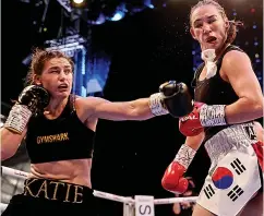  ??  ?? PACKING A PUNCH Katie Taylor unleashes a lethal left to the chin of Han