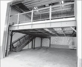  ?? ERIC SEALS/DETROIT FREE PRESS/TNS ?? The individual car condos vary in size and price, but each includes room to park vehicles on the lower level and an upper loft area that could be use for storage, an office or an apartment.