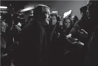  ?? Joe Amon, Denver Post file ?? U.S. Sen. Michael Bennet of Colorado talks to reporters after speaking to Polk County Democrats in Johnston during a trip to Iowa in February. Bennet, who has recovered from prostate cancer surgery, announced Thursday he is running for president.