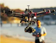  ?? Getty Images/files ?? The Federal Aviation Administra­tion is considerin­g requests to allow drones to be used in agricultur­e, land surveying and oilfield operations.