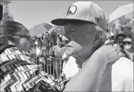  ?? PHOTO BY CESAR NEYOY/BAJO EL SOL ?? MEXICAN PRESIDENT-ELECT ANDRES MANUEL LOPEZ OBRADOR is embraced by a supporter Friday during his visit to San Luis Rio Colorado, Son.