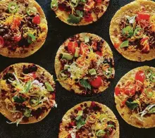  ?? Chronicle Books ?? Snoop Dogg's Soft Touch Tacos are made with a chili-spiced ground beef and a colorful mix of toppings.