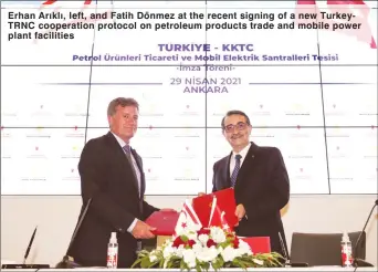  ??  ?? Erhan Arıklı, left, and Fatih Dönmez at the recent signing of a new TurkeyTRNC cooperatio­n protocol on petroleum products trade and mobile power plant facilities