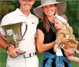  ?? GETTY IMAGES ?? Proud family: McIlroy with wife Erica and daughter Poppy