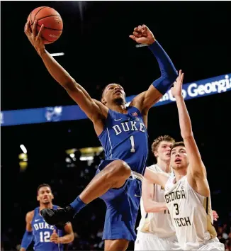  ?? JOHN BAZEMORE / ASSOCIATED PRESS ?? Georgia Tech forward Evan Cole (right) can’t do much to stop Duke guard Trevon Duval from scoring. The Blue Devils’ skill and athleticis­m were too much for the Yellow Jackets.