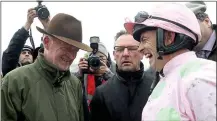  ??  ?? CHAMPIONS: Willie Mullins (left) and Ruby Walsh share a joke on a day they both ended as title winners in Ireland