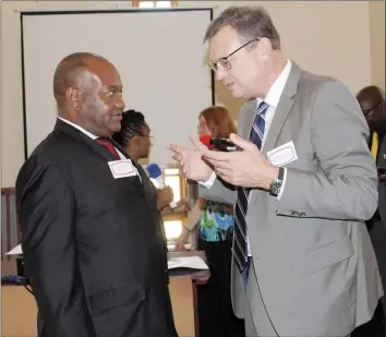  ??  ?? Harare Mayor Councillor Bernard Manyenyeni discusses with German Ambassador to Zimbabwe Mr Thorsten Hutter at the Geographic Informatio­n Systems Conference in Harare yesterday. — (Picture by Innocent Makawa)