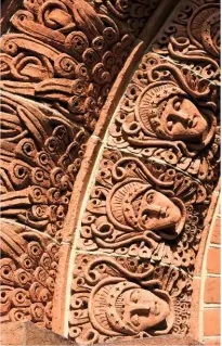  ??  ?? Villagers taught by Mary Watts helped make terracotta relief tiles of angels’ faces.