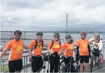  ??  ?? Pedal power The Sainsbury’s cyclists take a well-earned break to pose for a picture