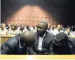  ??  ?? VUSI “Khekhe” Mathibela, Elias Skhosana and Stemer Monageng in the Pretoria Magistrate’s Court yesterday on charges of intimidati­on and extortion. | BONGANISHI­LUBANE African News Agency (ANA)