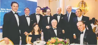  ??  ?? TALK ABOUT GOOD TABLES! Standing, from left: Mark Mulroney, Brian Hannasch, Dany Beauchemin, Charles Émond, Brian Porter, Jean-Guy Desjardins and Mitch Garber. Seated, from left: Michelle Khalili, Brian Mulroney and James Neate.