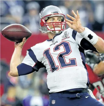  ?? KEVIN C. COX/GETTY IMAGES ?? New England Patriots’ QB Tom Brady attempts a pass during the fourth quarter against the Atlanta Falcons during Super Bowl 51 at NRG Stadium, in Houston, Texas.