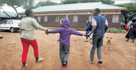  ?? PHOTO: ANTONIO MUCHAVE ?? Three children from a Limpopo family aged 13, 10 and six years attended school for the first time in their lives yesterday. Their poor mother could not afford to send them to school.