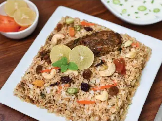  ??  ?? The Thalassery chicken biryani is a mishmash of rice, chicken, and spices; (below) Kannur is also home to many training centres of kalaripaya­ttu— the traditiona­l martial art form of Kerala.