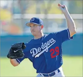  ?? Ross D. Franklin Associated Press ?? STILL NOT UP TO SPEED with a fastball clocked in the mid-80s, Scott Kazmir struggled Sunday and appears unlikely to break camp with the Dodgers this week.