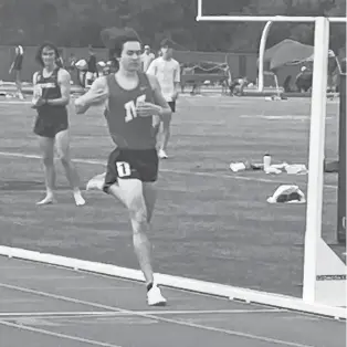  ?? DOM AMORE/HARTFORD COURANT ?? Manchester High’s Aiden Puffer crosses the finish line, winning the Class LL title in the 1,600 meters in New Britain on Tuesday.