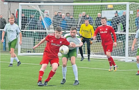  ??  ?? Action from Broughty Athletic’s 2-1 win over St Roch’s (white) in the Scottish Cup fifth round at Whitton Park.