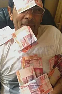  ??  ?? ‘Exploitati­ve’: Vojtech Gombar poses with £100 notes