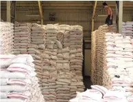  ?? PHILIPPINE STAR/MICHAEL VARCAS ?? A WORKER at NFA Quezon City warehouse arranging newly arrived buffer stock.