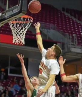  ?? PETE BANNAN — DIGITAL FIRST MEDIA ?? Penncrest’s Matt Arborgast taps in a basket in the third quarter of the Lions’ District 1 Class 5A championsh­ip game victory over Bishop Shanahan at Temple’s Liacouras Center Saturday.