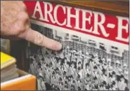  ??  ?? Ives points to himself in a 1981 photo with the Archer-Epler Musketeers Drum and Bugle Corps. The marching band costumes, instrument­s, banners, flags, photos, programs, recordings, regalia, and memorabili­a Ives has assiduousl­y amassed since 1990 — 24,000 pieces, and counting — are a showstoppe­r.