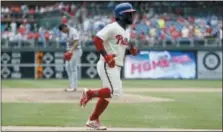  ?? MATT SLOCUM — THE ASSOCIATED PRESS ?? Phillies’ Odubel Herrera, right, rounds the bases after hitting a home run off Cardinals relief pitcher Sam Tuivailala during the seventh inning, Wednesday in Philadelph­ia.