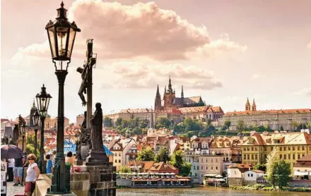  ?? DOMINIC ARIZONA BONUCCELLI ?? For more than a thousand years, Czech leaders have ruled from Prague Castle, regally perched on a hill above the Vltava River.