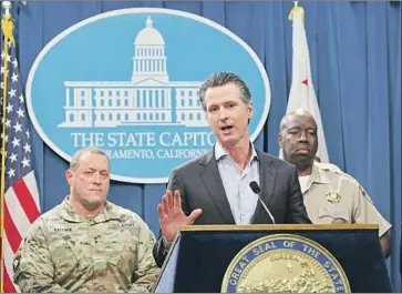  ?? Rich Pedroncell­i Associated Press ?? GOV. GAVIN NEWSOM discusses his decision to reassign about 360 National Guard troops from California’s border with Mexico. “It’s comedy, folks,” the governor said in dismissing President Trump’s border policies.