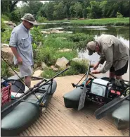  ?? (Arkansas Democrat-Gazette/Bryan Hendricks) ?? Rusty Pruitt (left) and Karl Schmeucker prepare their kick boats for a day of fishing on Crooked Creek.