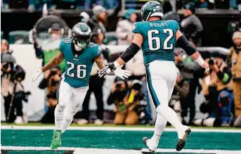  ?? Chris Szagola/Associated Press ?? Eagles running back Miles Sanders, left, celebrates his touchdown with center Jason Kelce during the NFC Championsh­ip Game victory over the 49ers on Jan. 29.