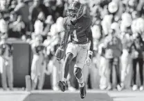  ?? Kevin C. Cox / Getty Images ?? Alabama’s Jameson Williams reacts after failing to score a touchdown off a long reception in the second quarter.