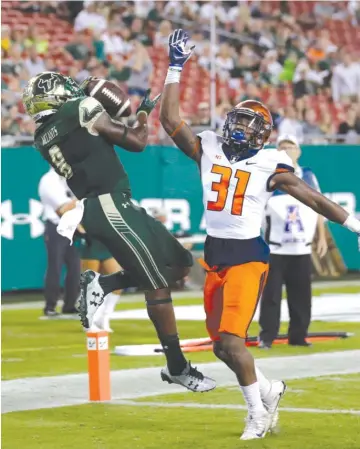  ?? AP ?? South Florida receiver Tyre McCants pulls in a touchdown pass last season against Illinois in Tampa, Fla.