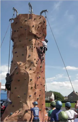  ??  ?? Year six pupils take part in induction week at Norden High School in Rishton Pictured having a go on a climbing wall