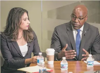  ?? RICH HEIN/SUN-TIMES ?? Erika Harold and Kwame Raoul at a Sun-Times Editorial Board meeting in September.