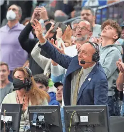  ?? STEPHEN R. SYLVANIE/USA TODAY SPORTS ?? Basketball commentato­r Dick Vitale waves during a standing ovation in his honor at Tuesday’s game between Gonzaga and UCLA.