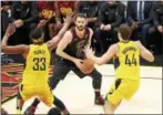  ?? TIM PHILLIS — THE NEWS-HERALD ?? Kevin Love works against the Pacers’ Myles Turner and Bojan Bogdanovic on April 15 at Quicken Loans Arena.