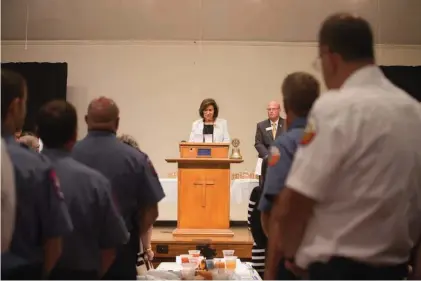  ?? Staff photo by Evan Lewis ?? Texarkana, Ark., Mayor Ruth Penney Bell reads an end of watch memorial Thursday for Miller County Sheriff's Office Detention Supervisor Lisa Mauldin. Mauldin died in the line of duty on Dec. 18, 2016. Texarkana Rotary Clubs hosted their 37th annual...