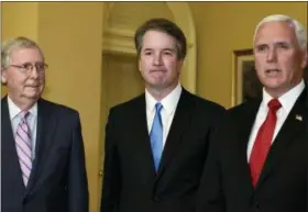  ?? SUSAN WALSH - THE ASSOCIATED PRESS ?? Vice President Mike Pence, right, speaks about Supreme Court nominee Brett Kavanaugh, center, as Senate Majority Leader Mitch McConnell of Ky., left, listens during a visit to Capitol Hill in Washington, Tuesday.