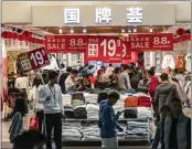  ?? QILAI SHEN — THE NEW YORK TIMES ?? Retail sales, such as clothing, in China have picked up, according to data from the beginning of the year.